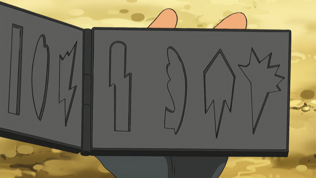 An image of an open badge case. There are distinct indentations where the badges should go.